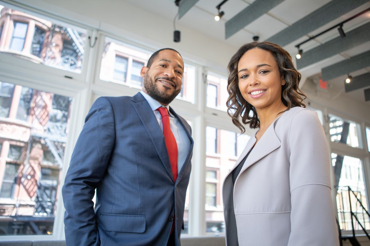 Black business executives in modern corporate boardroom representing Renalytica client advisory team