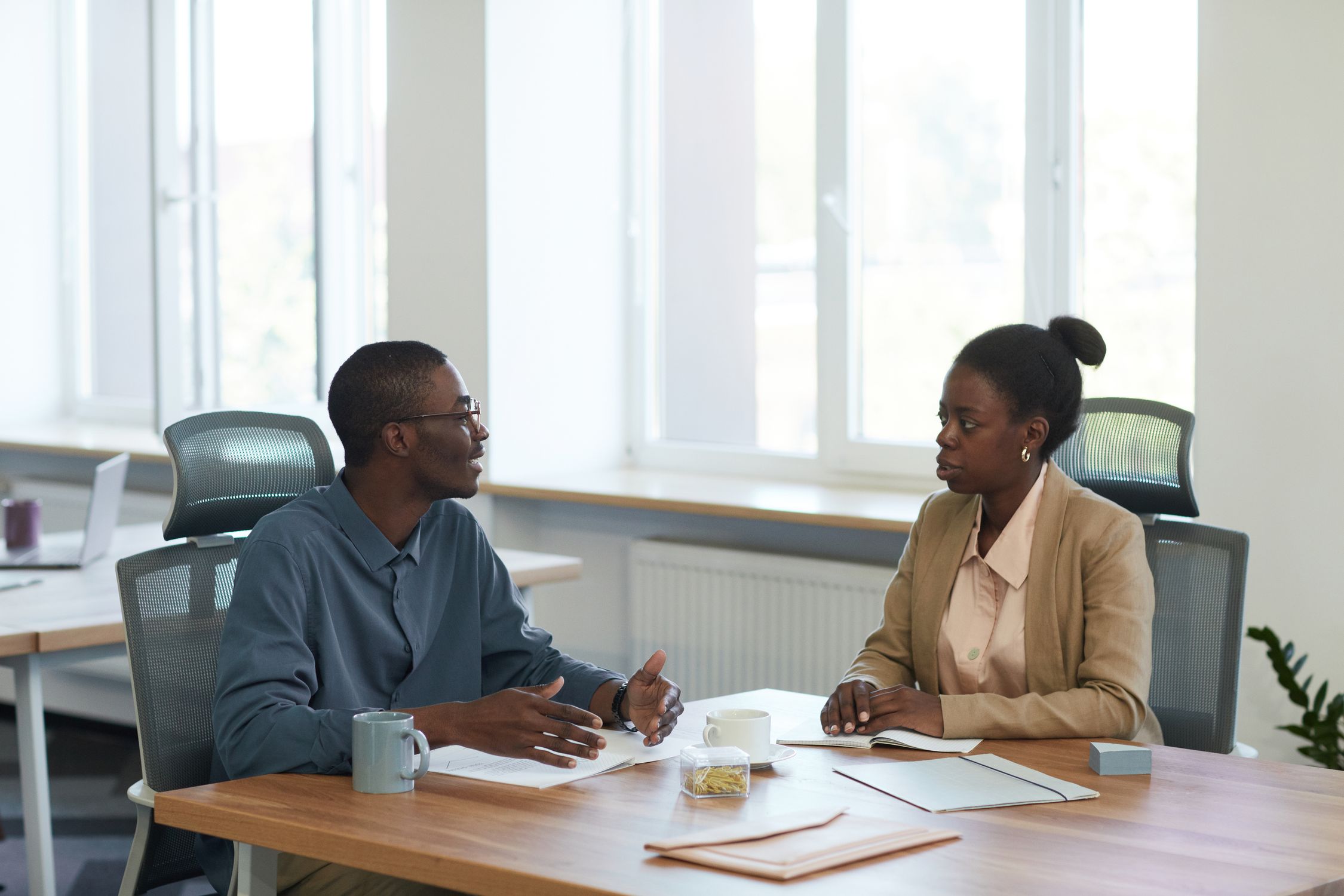 Senior African corporate business executives in analytical consultation
